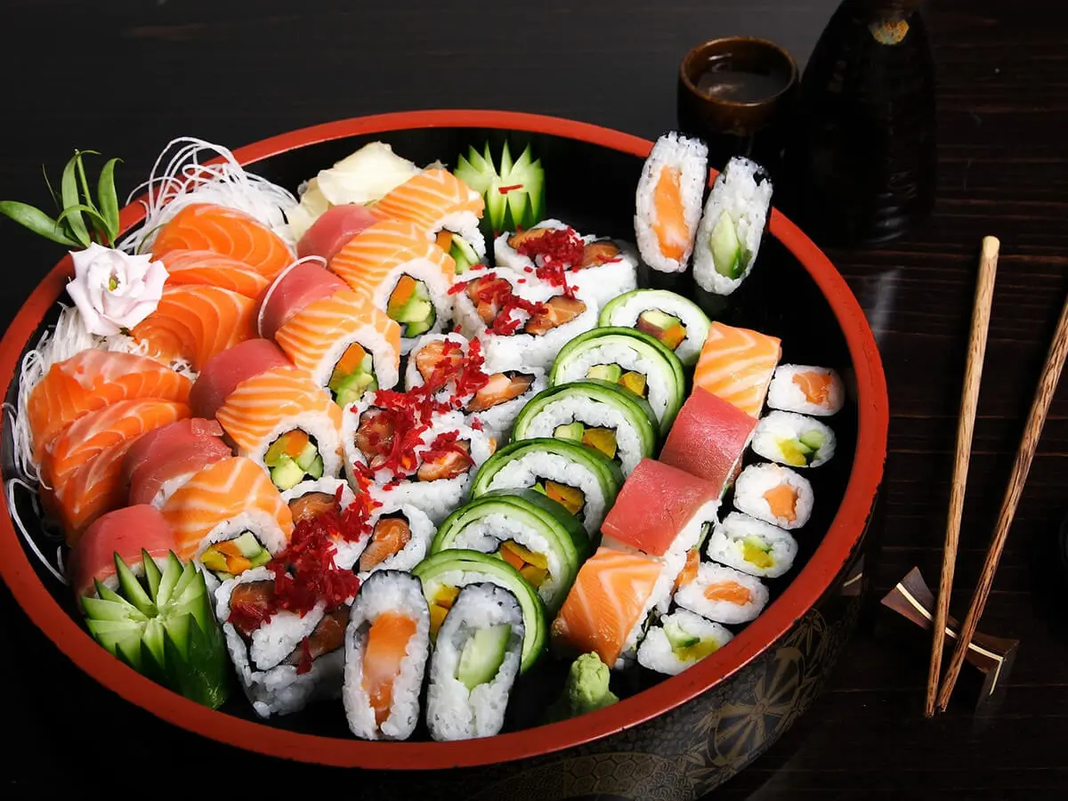 Deluxe Sushi Platter presents a large assortment of sushi rolls and nigiri sushi at Sumo Sushi Hibachi, a Japanese restaurant in Daytona Beach